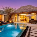 Modern villa with private pool at dusk