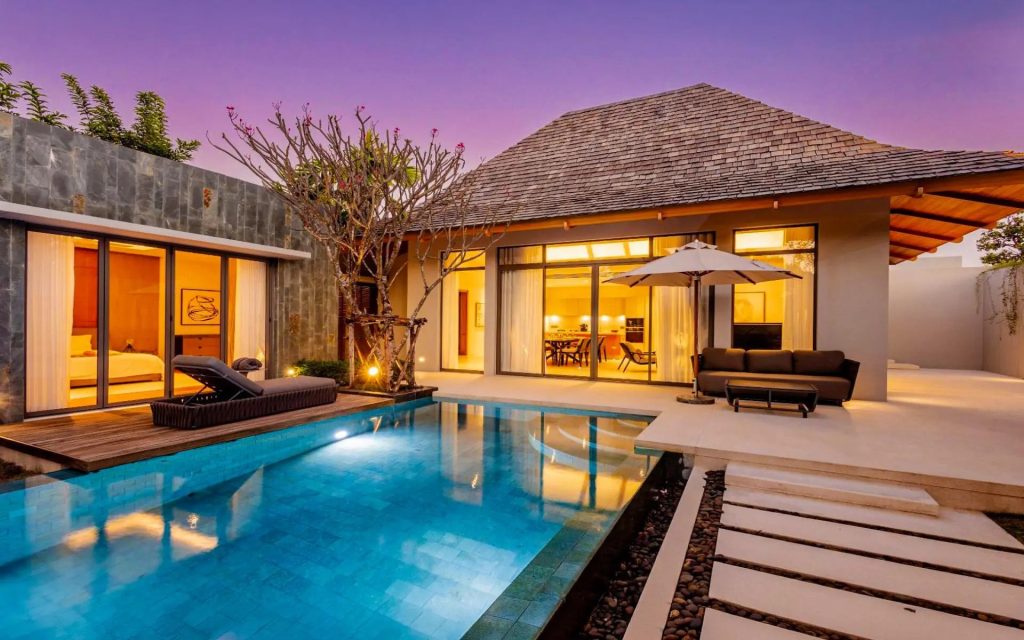 Modern villa with private pool at dusk