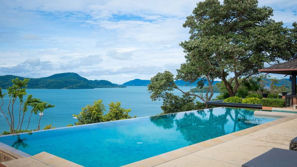 Infinity pool overlooking tropical sea and islands