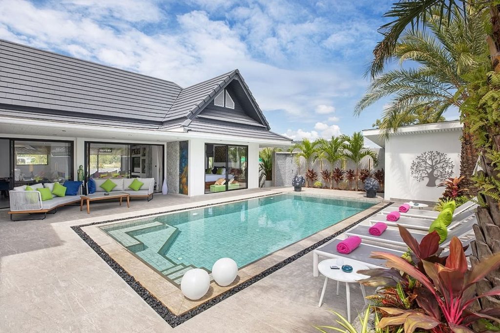 Modern villa with private swimming pool and loungers