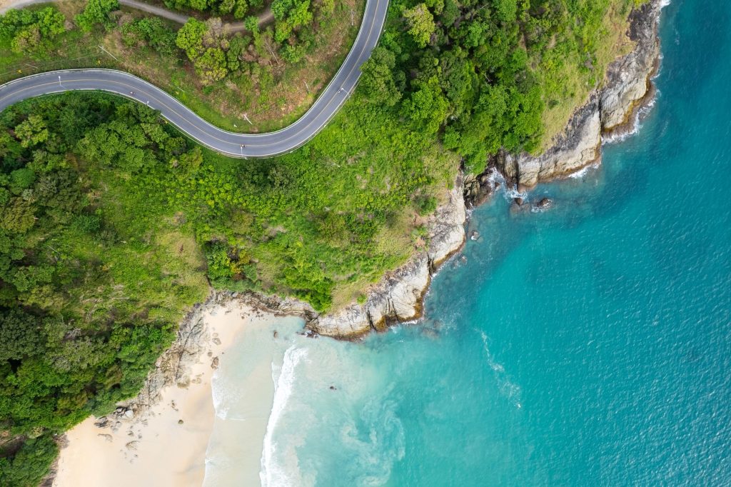 Aerial view of winding coastal road and turquoise sea