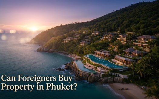 Luxury hillside villas overlooking Phuket coastline at sunset